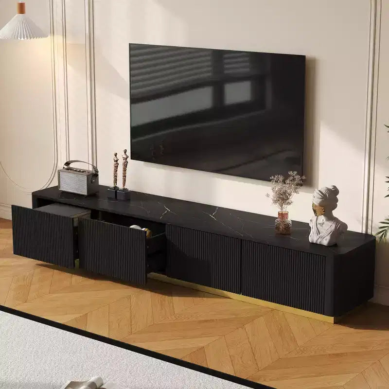 Meuble TV cannelé pour téléviseurs jusqu'à 85 pouces, console média avec plateau en faux marbre et 4 tiroirs, meuble de divertissement avec base dorée