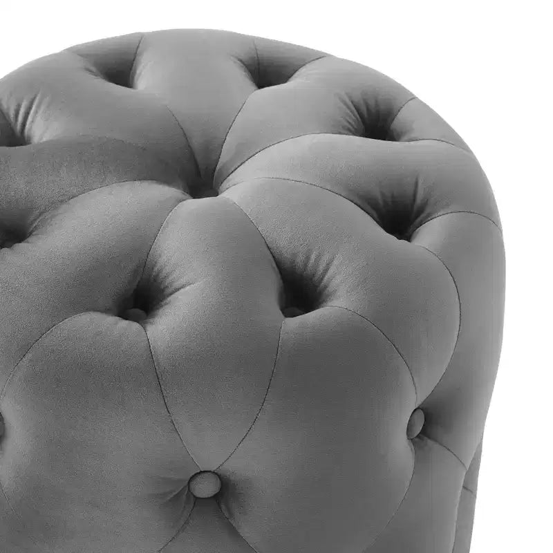 Pouf rond capitonné en velours performant