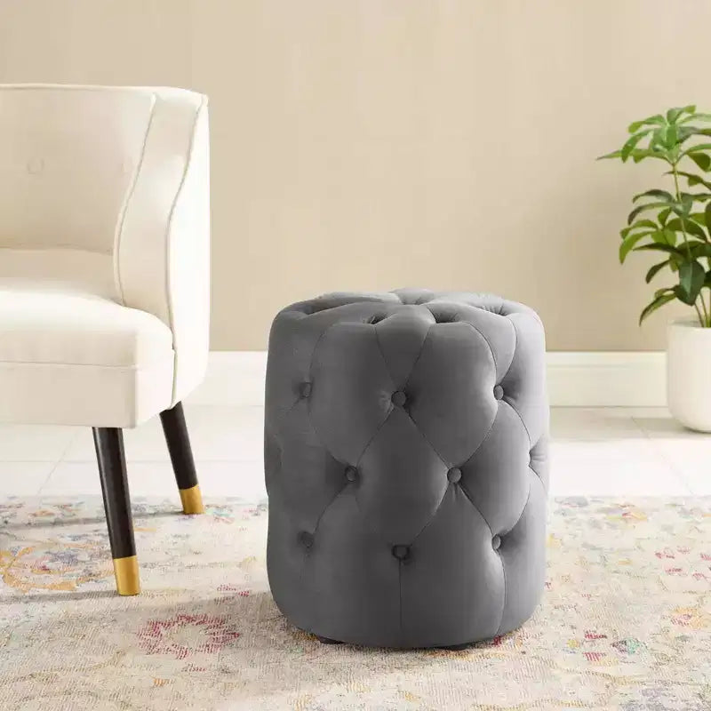 Pouf rond capitonné en velours performant