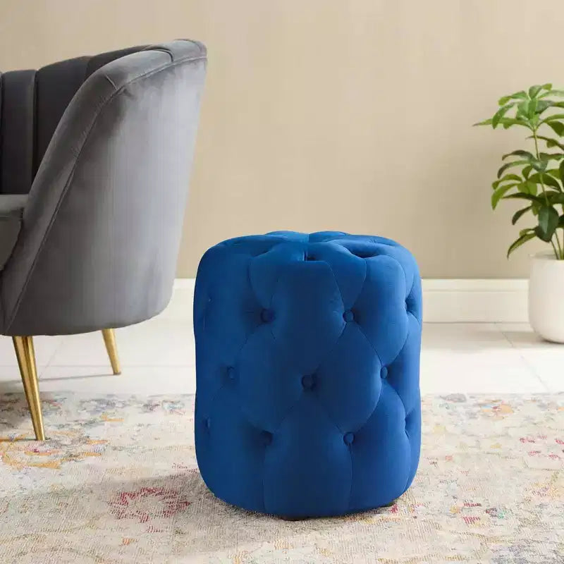 Pouf rond capitonné en velours performant